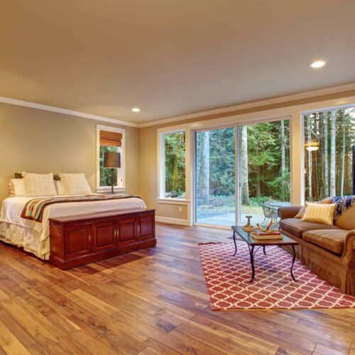 Canva-Large-master-bedroom-wth-hardwood-floor.